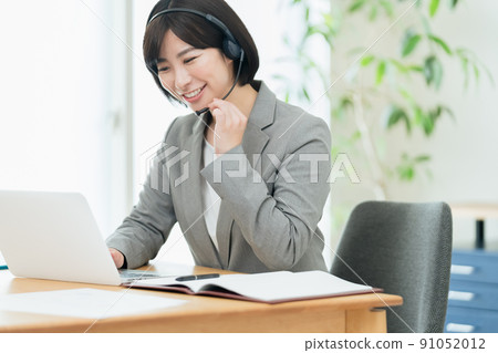 Businesswoman having an online meeting Businesswoman having an online meeting 91052012