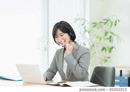 Businesswoman having an online meeting Businesswoman having an online meeting 91052013