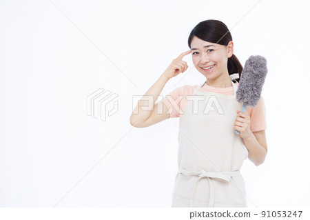 Housewife in her thirties cleaning with a mop Housewife in her thirties cleaning with a mop 91053247