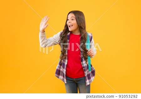 High five greeting. Happy kid yellow background. School age kid. Back to school. Basic education. High five greeting. Happy kid yellow background. School age kid. Back to school. Basic education. 91053292