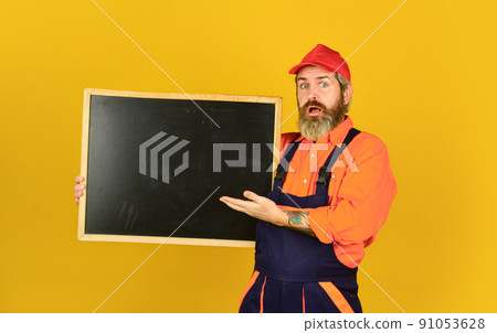 Mechanic perform repair. Man hold chalkboard Mechanic perform repair. Man hold chalkboard 91053628