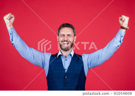 mature smiling guy in suit celebrating success, yes 91054609
