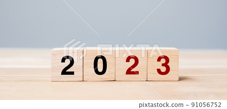 wooden cube block with 2023 text on table background. Resolution, plan, review, goal, start and New Year holiday concepts wooden cube block with 2023 text on table background. Resolution, plan, review, goal, start and New Year holiday concepts 91056752