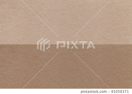Texture of craft brown and beige paper background, half two colors, macro. Structure of vintage umber cardboard. 91058371