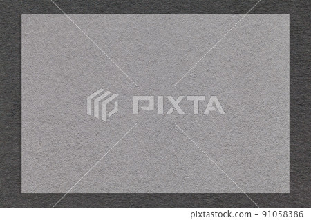 Texture of craft gray color paper background with black border, macro. Structure of vintage dense kraft grey cardboard Texture of craft gray color paper background with black border, macro. Structure of vintage dense kraft grey cardboard 91058386