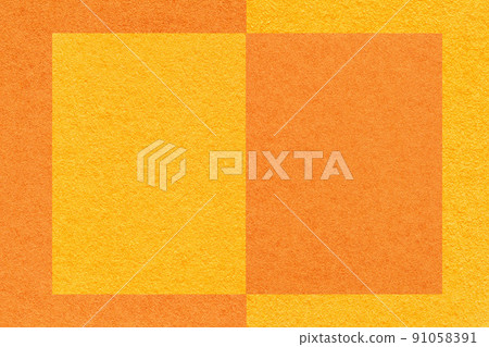 Texture of yellow and orange paper background with geometric pattern, macro. Structure of craft cardboard with frame. Texture of yellow and orange paper background with geometric pattern, macro. Structure of craft cardboard with frame. 91058391