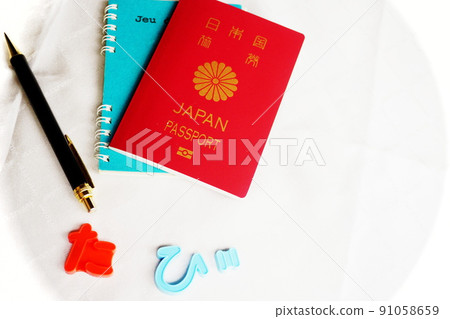 Passport, pen placed on the notebook Passport, pen placed on the notebook 91058659