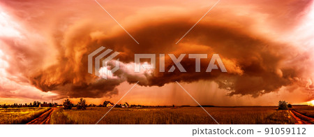 Dangerous storm, climate change concept, red storm clouds, heatwave Dangerous storm, climate change concept, red storm clouds, heatwave 91059112