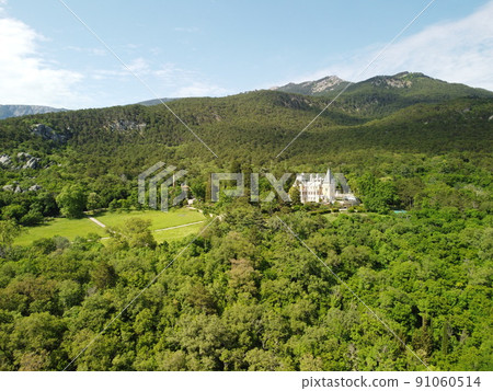 Massandra Palace of Emperor Alexander III is located in the Upper Massandra on the southern coast of Crimea. Summer green park museum. Renaissance architectural monument. Manor castle Aerial View 91060514