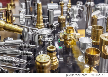 different shapes and sizes of parts turned on a lathe or milling machine. different shapes and sizes of parts turned on a lathe or milling machine. 91062148