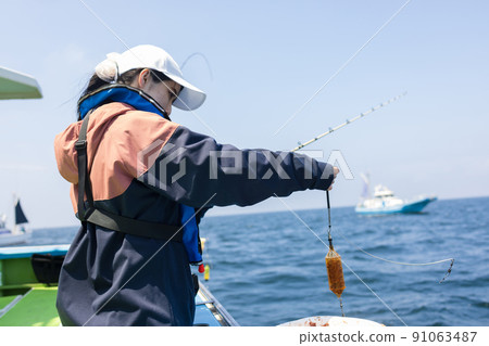 Cute woman fishing Cute woman fishing 91063487