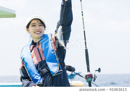 Cute woman fishing Cute woman fishing 91063615
