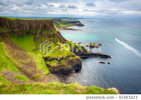The Amphitheatre, Port Reostan Bay and Giant's Causeway on background, County Antrim, Northern Ireland, UK 91063823