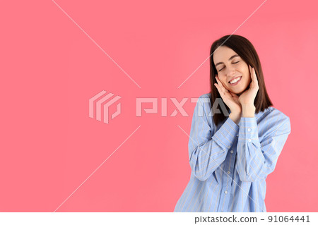 Young attractive woman in shirt on pink background 91064441