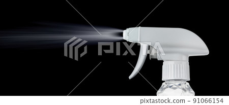 Close view of a plastic spray bottle's head for dispersion isolated on a black background 91066154