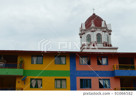 typically colourful buildings facade in Guatape, Colombia. cityscape typically colourful buildings facade in Guatape, Colombia. cityscape 91066582