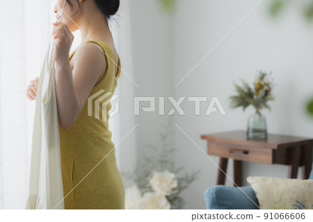 Woman worried about clothes 91066606
