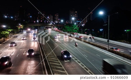 freeway in Sao Paulo city at night, long exposure, light trails. 91066609