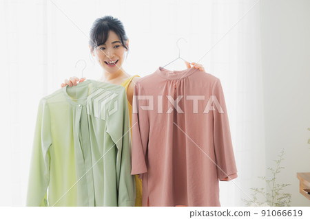 Woman worried about clothes 91066619