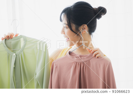 Woman worried about clothes 91066623