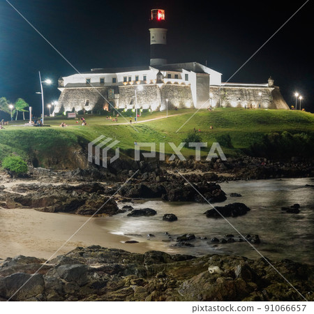 Barra Lighthouse, or Farol da Barra, in Salvador, Bahia, Brazil, at night 91066657