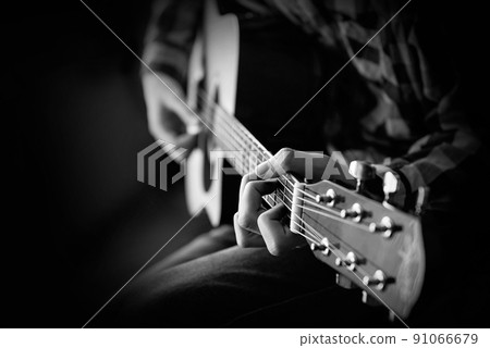 men playing acoustic guitar 91066679