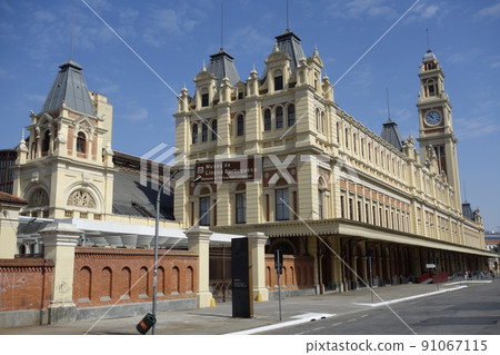 exterior view of building of Luz Station and Museum of Portuguese Language in Sao Paulo city. famous urban train station 91067115