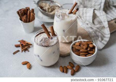 Horchata drink - traditional mexican rice based drink with cinnamon and almonds Horchata drink - traditional mexican rice based drink with cinnamon and almonds 91067721