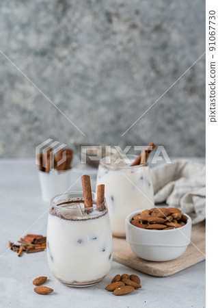 Horchata drink - traditional mexican rice based drink with cinnamon and almonds Horchata drink - traditional mexican rice based drink with cinnamon and almonds 91067730