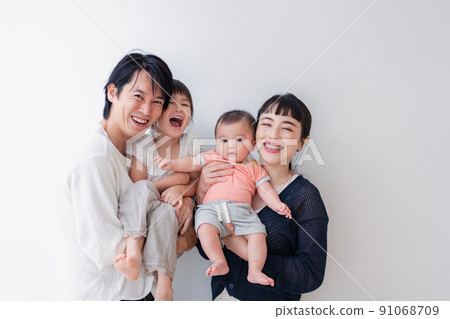 Group photo of a family with a baby Group photo of a family with a baby 91068709