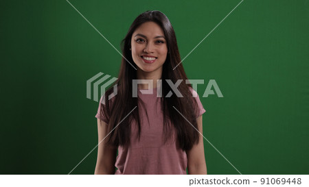 Young pretty woman looks very happy Young pretty woman looks very happy 91069448