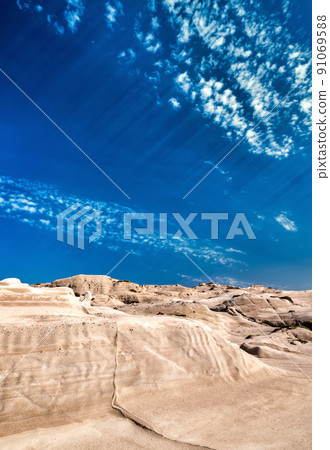 Famous rocks of Sarakiniko beach, Aegean sea, Milos island , Greece. No people, empty cliffs, summer sunshine, lunar landscape, deep blue sky, clouds 91069588