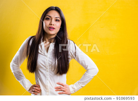 Young self-confident woman in a studio Young self-confident woman in a studio 91069593