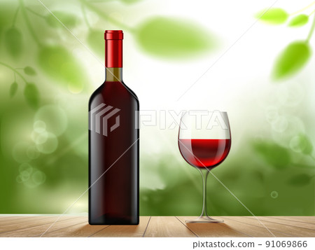 Bottle of red wine and a glass stand on a wooden table 91069866