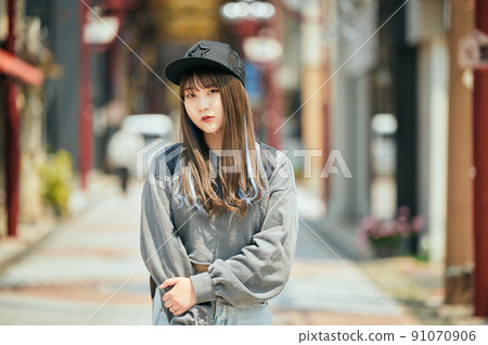 Gen Z women standing looking at the camera 91070906