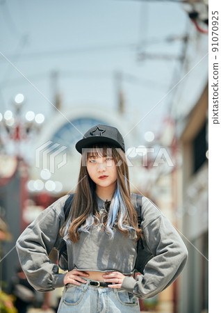 Gen Z women standing looking at the camera 91070925