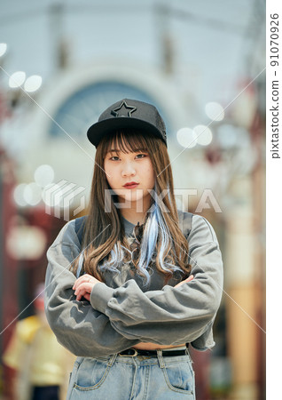 Gen Z women standing looking at the camera 91070926