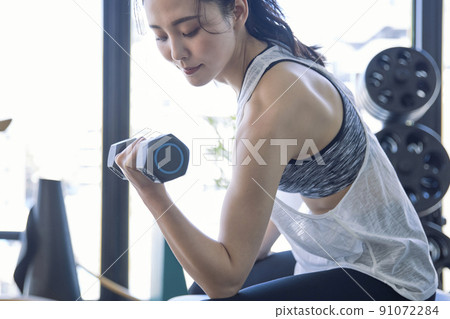 Young woman training in the gym Young woman training in the gym 91072284