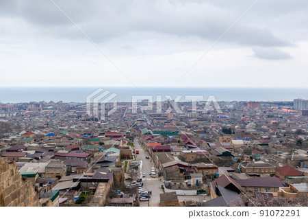 Old town along the blue sea, top view. The ancient city of Derbent 91072291