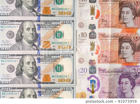 Pounds sterling. Cash UK. Cash 100 US dollars. The bills are lying nearby. The exchange rate. Economy. Crisis Pounds sterling. Cash UK. Cash 100 US dollars. The bills are lying nearby. The exchange rate. Economy. Crisis 91073959