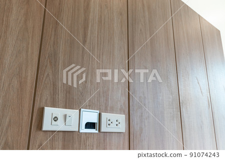 Power outlet on wooden Wall Background Power outlet on wooden Wall Background 91074243