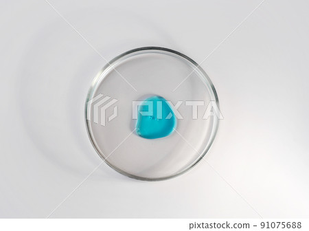 Laboratory glass petri dish with drop of water, serum, oil, beauty product. Natural medicine, cosmetic research, bio science. Concept of skincare and analysis. Dermatology. Flat lay, top view 91075688