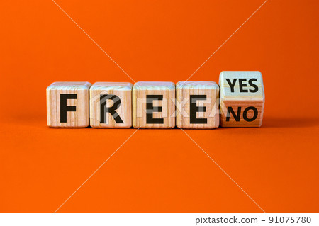 Feel free. Turned a cube and changed the words 'free no' to 'free yes'. Beautiful orange background. Business concept. Copy space. Feel free. Turned a cube and changed the words 'free no' to 'free yes'. Beautiful orange background. Business concept. Copy space. 91075780