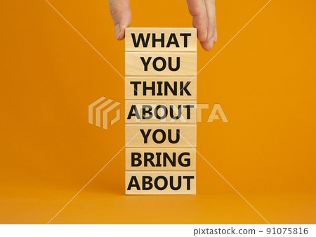 Think about bring about symbol. Wooden blocks with words What you think about you bring about. Beautiful orange background. Businessman hand. Business, motivational think or bring concept. Copy space. 91075816