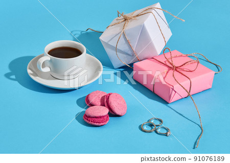 Valentine's day greeting card. White coffee cup, pink macaroons Valentine's day greeting card. White coffee cup, pink macaroons 91076189
