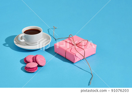Valentine's day greeting card. White coffee cup, pink macaroons 91076203