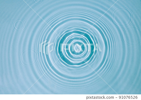 Blue water texture, surface with rings, ripples. Spa concept background 91076526