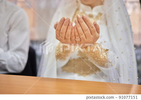 National wedding. Bride and groom. Wedding muslim couple during the marriage ceremony. Muslim marriage. National wedding. Bride and groom. Wedding muslim couple during the marriage ceremony. Muslim marriage. 91077151
