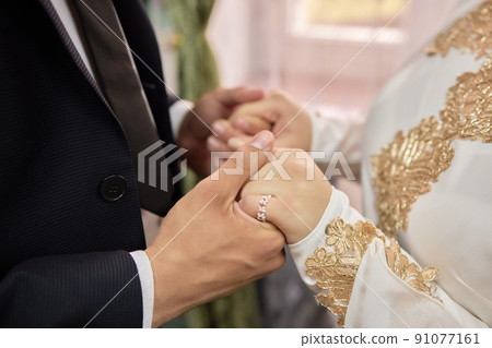National wedding. Bride and groom. Wedding muslim couple during the marriage ceremony. Muslim marriage. National wedding. Bride and groom. Wedding muslim couple during the marriage ceremony. Muslim marriage. 91077161