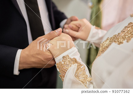 National wedding. Bride and groom. Wedding muslim couple during the marriage ceremony. Muslim marriage. National wedding. Bride and groom. Wedding muslim couple during the marriage ceremony. Muslim marriage. 91077162